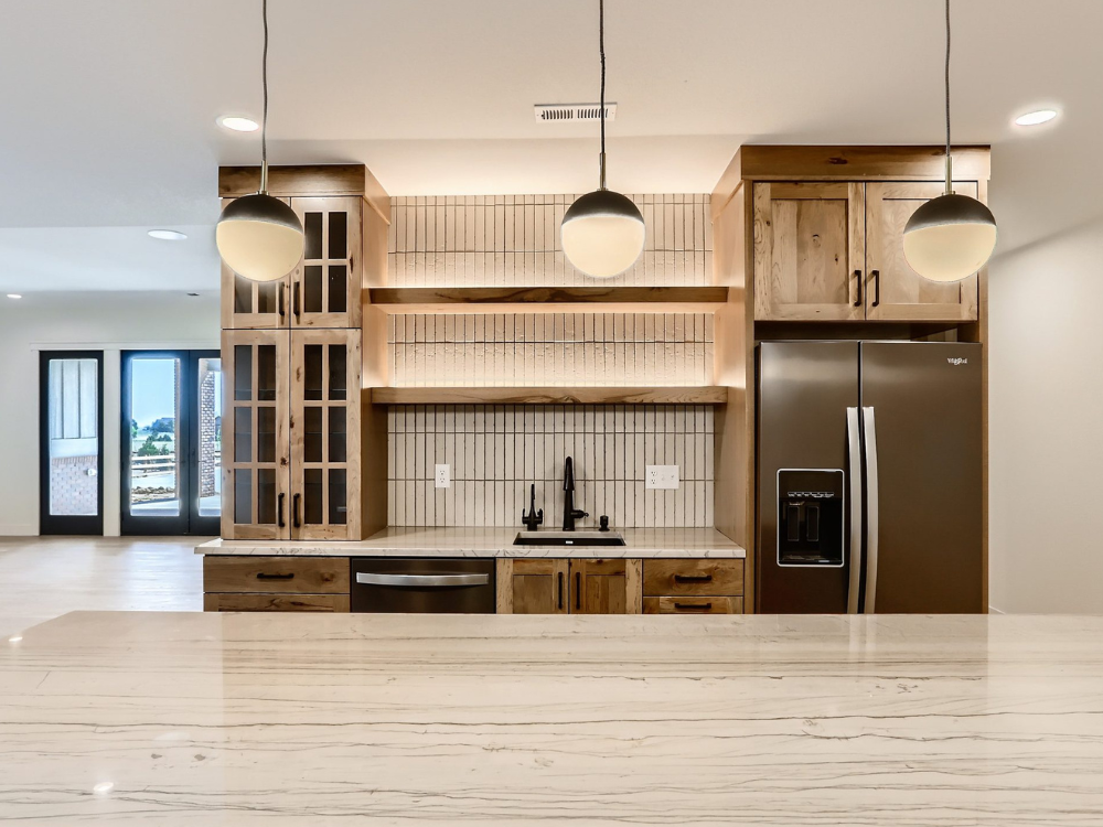 neutral kitchen with glass front cabinetry
